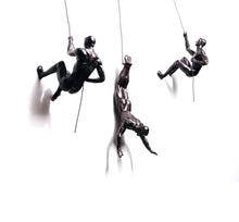 Abseiling Hanging sculptures
